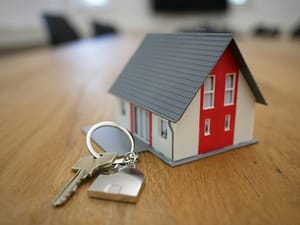 miniature house and keys for a first time buyer mortgage