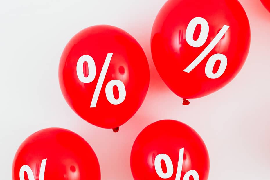 balloons showing % symbols to show inflation and interest rates - the primary reasons for using top slicing